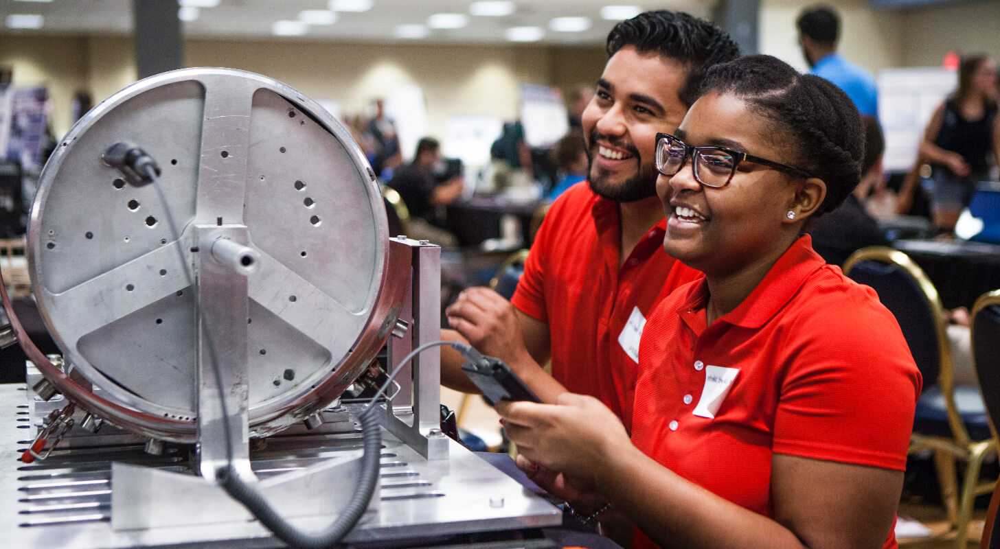 Research students showing their invention