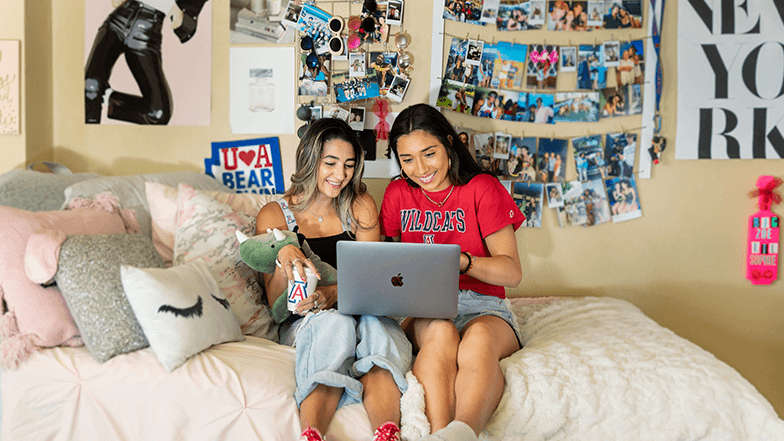 Students studying in their dorm