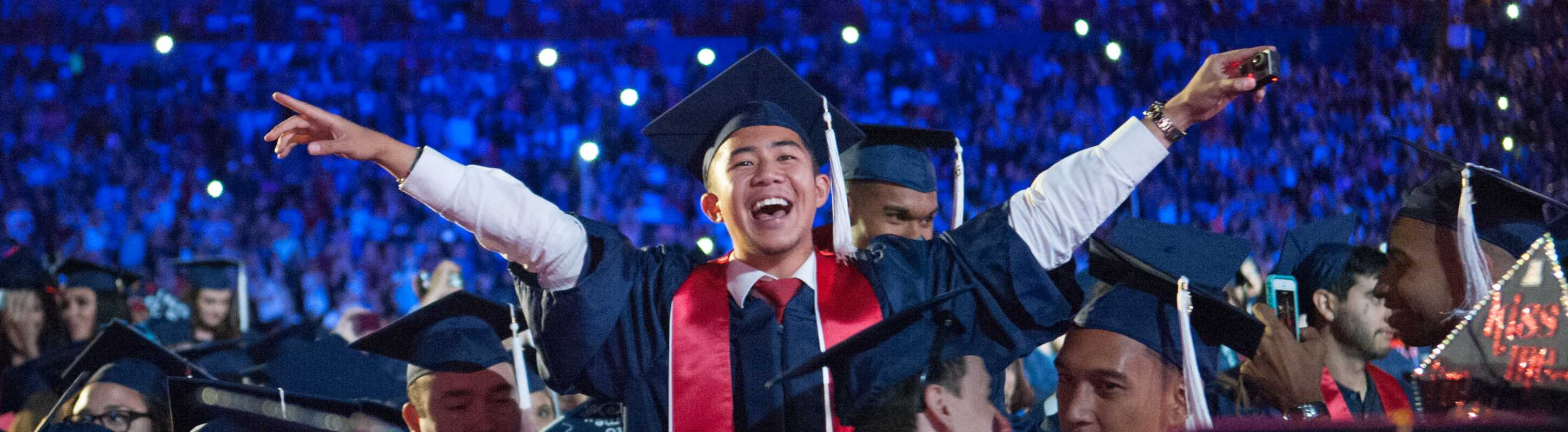 Student celebrating at Commencement