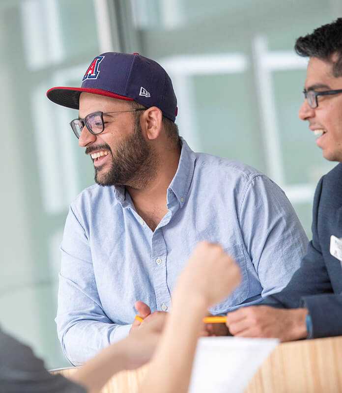 two students hanging out at the business college