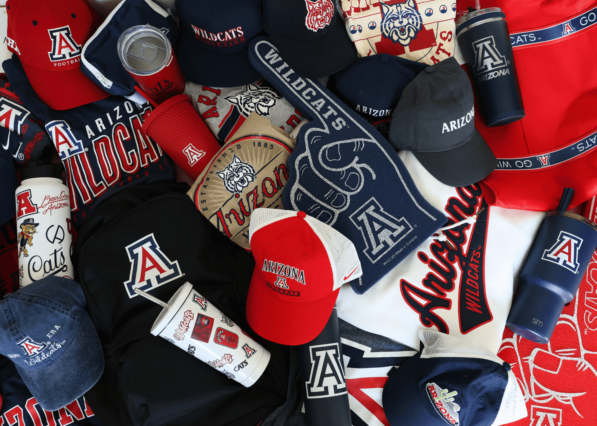 A photo of various pieces of University of Arizona branded merchandise. 