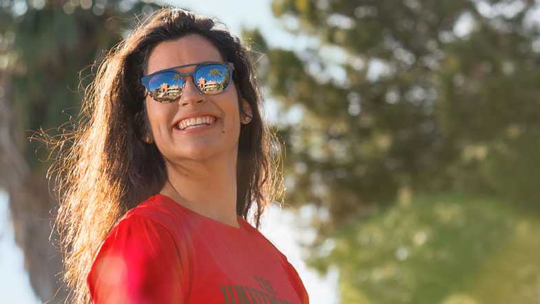 Student smiling and looking over her right shoulder