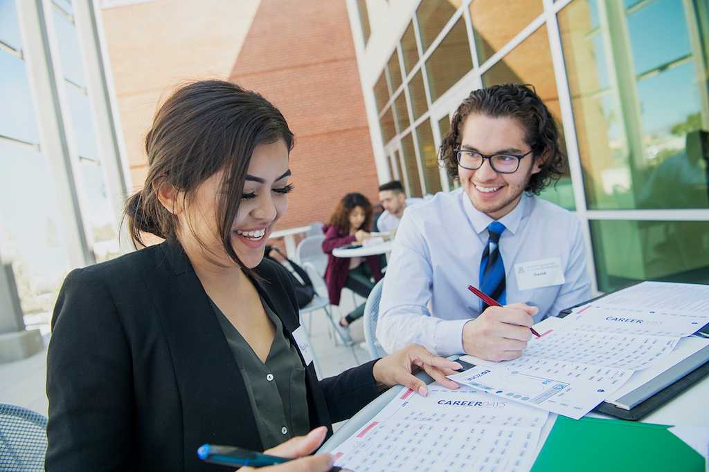 Male and female student at Career Days